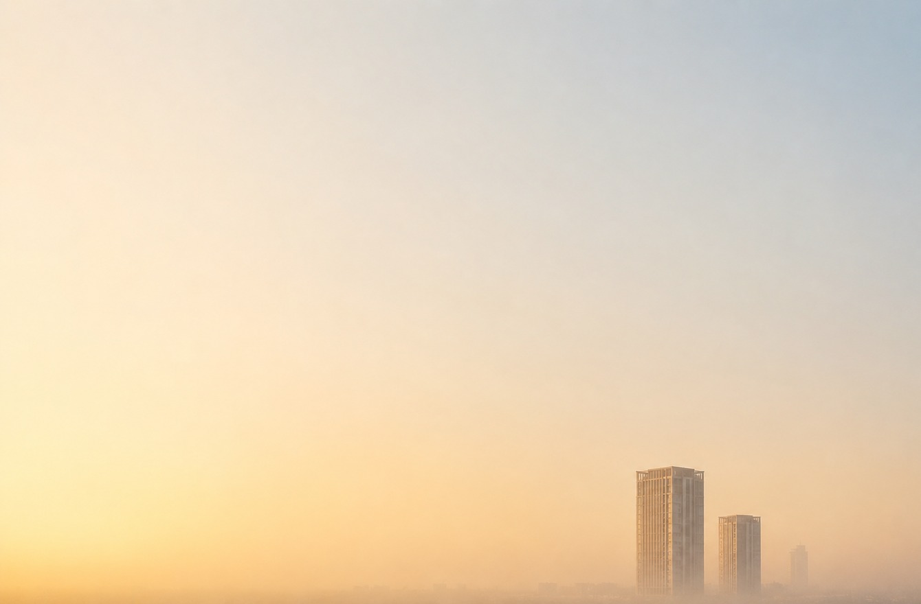 Atmospheric Lagos cityscape with rising high-rises shrouded in haze — PropertyPro editorial illustration for the Lagos rental crisis article